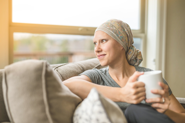 woman with scarf sitting on couch