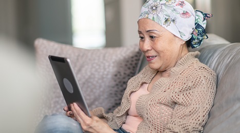 woman looking at tablet