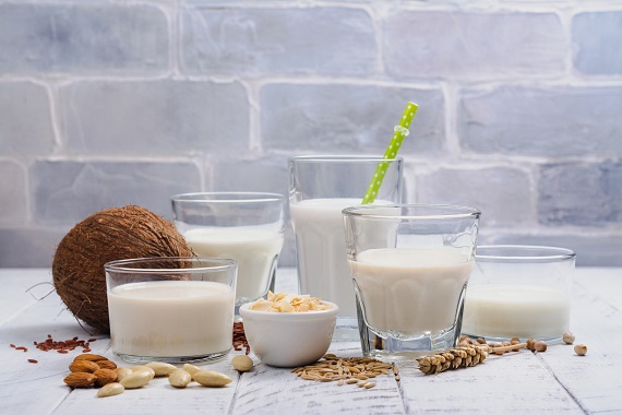 five glasses of different types of milk