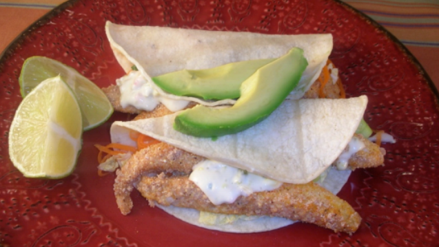 Tilapia tacos with creamy sauce and crunchy slaw