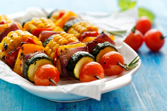 grilled vegetable skewers on a white serving dish