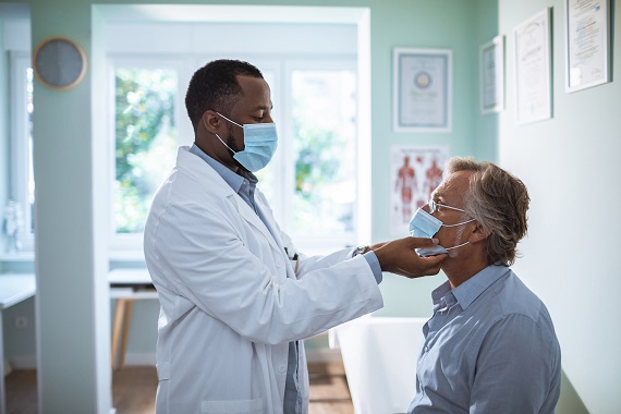 man having a medical exam at a doctor's office