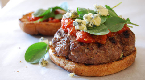 Grilled hamburger with tomato mostarda, arugula, and blue cheese 