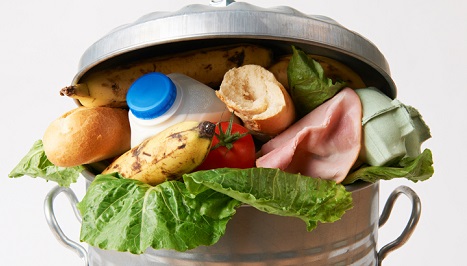 Food stuffed in a garbage can.