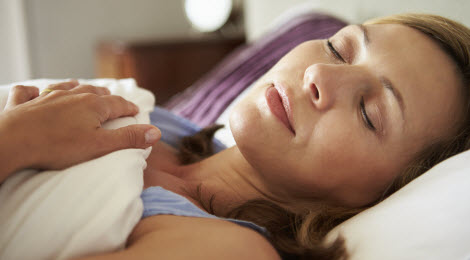 Woman sleeping in bed